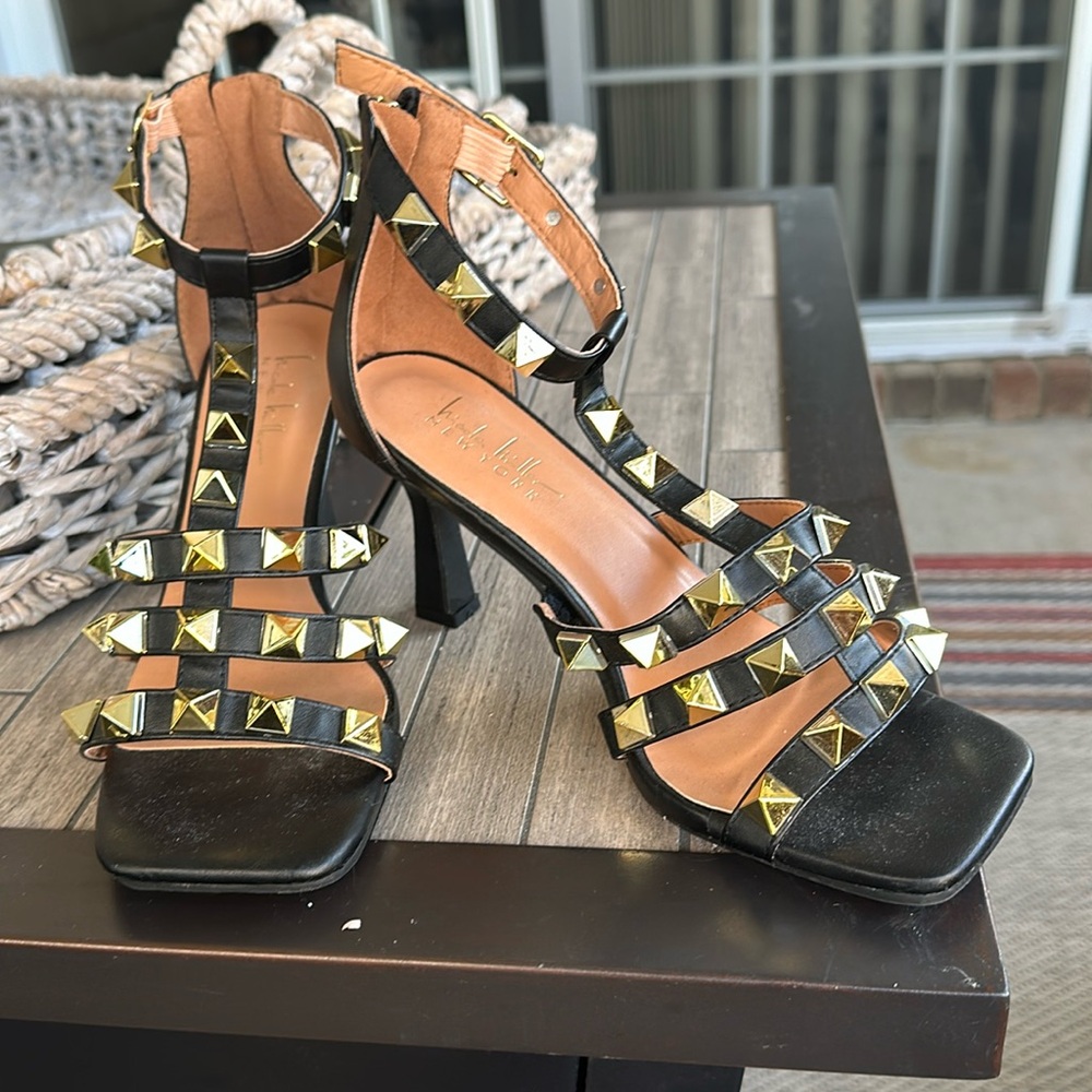 Nicole Miller black With gold studs 2 in heel shoes with back zipper.